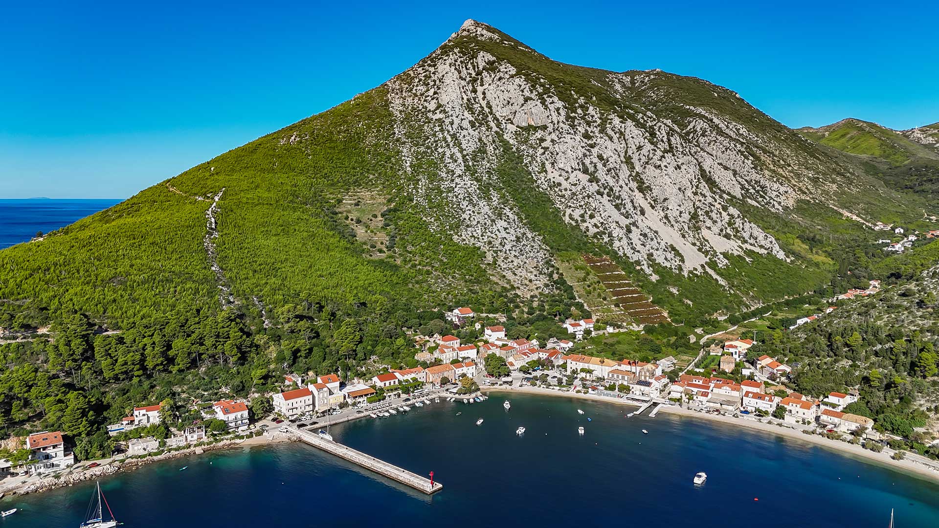 Trstenik from the air: the village, the bay and the mountain behind it
